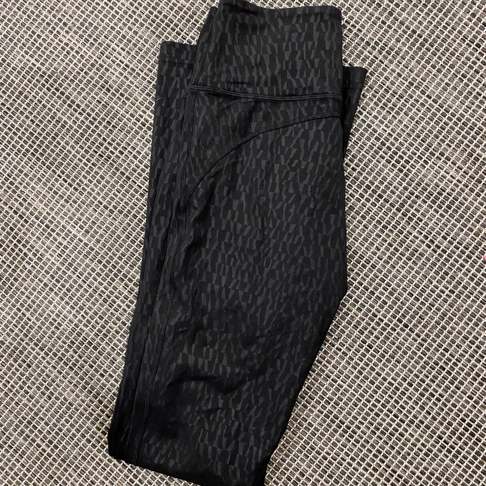 Lululemon, high rise tall flare black patterned leggings, size 8